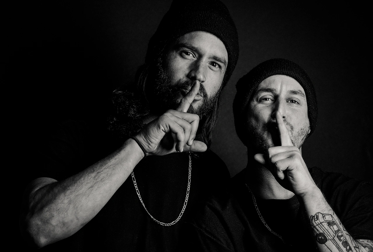 Dave Abair posing in a dramatic black-and-white portrait.