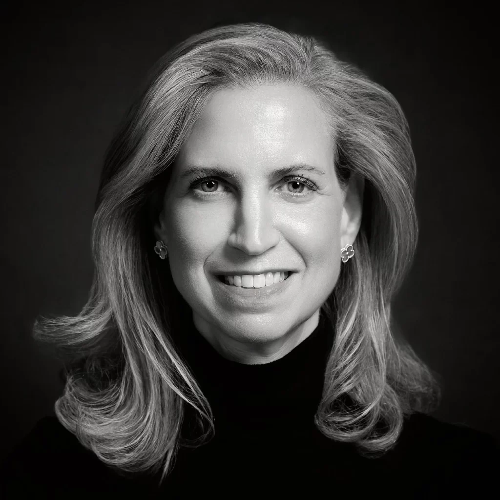 Black-and-white headshot of a finance professional in a dark turtleneck.